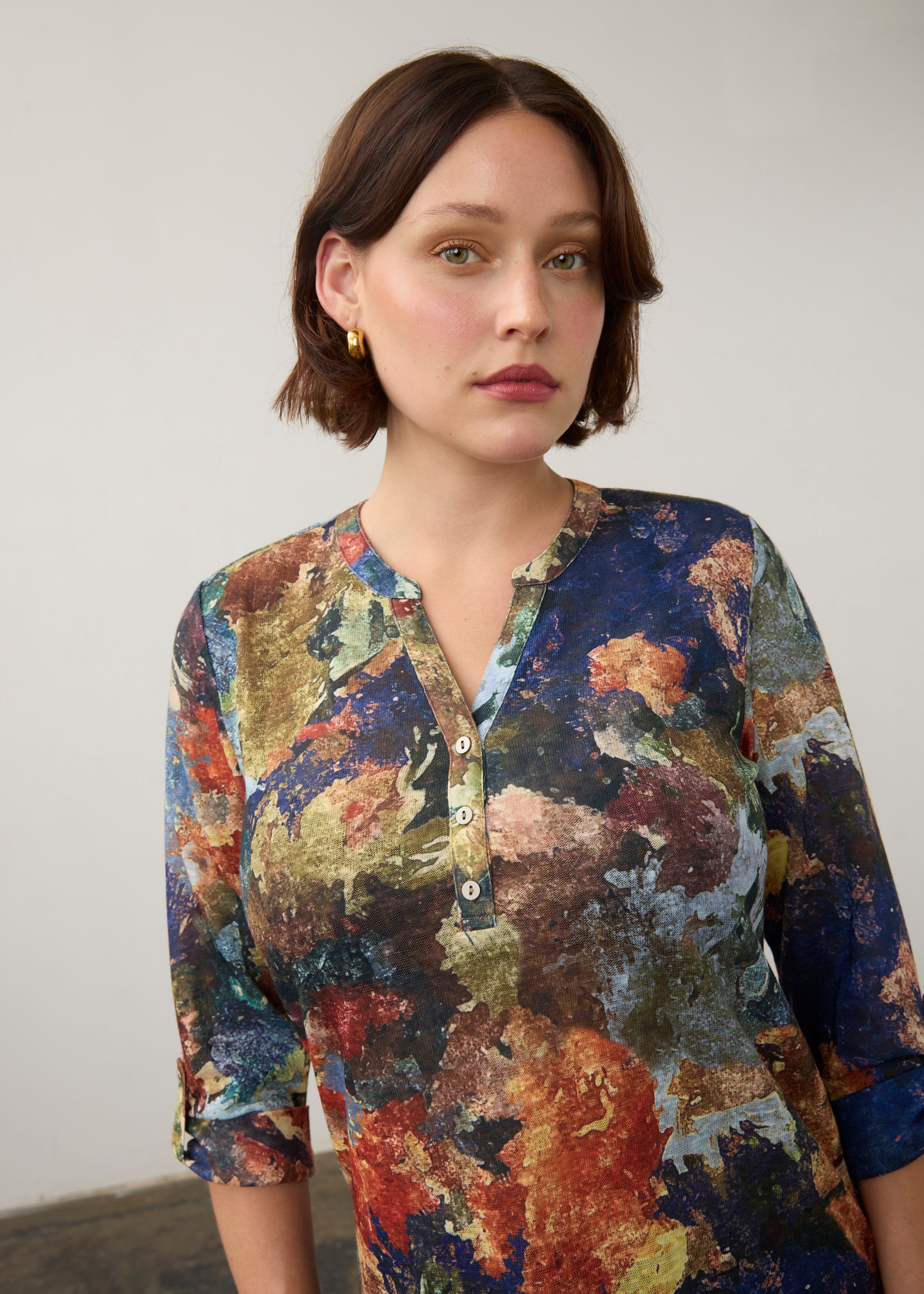 Close-up of multicolor Henley top highlighting button-front and abstract pattern by French Dressing Jeans (FDJ)