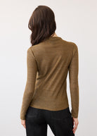 Back view of gold shimmer top showing seamless design and long sleeves by French Dressing Jeans (FDJ)