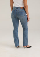 Back view of light wash jeans featuring back pockets and FDJ label by French Dressing Jeans (FDJ)