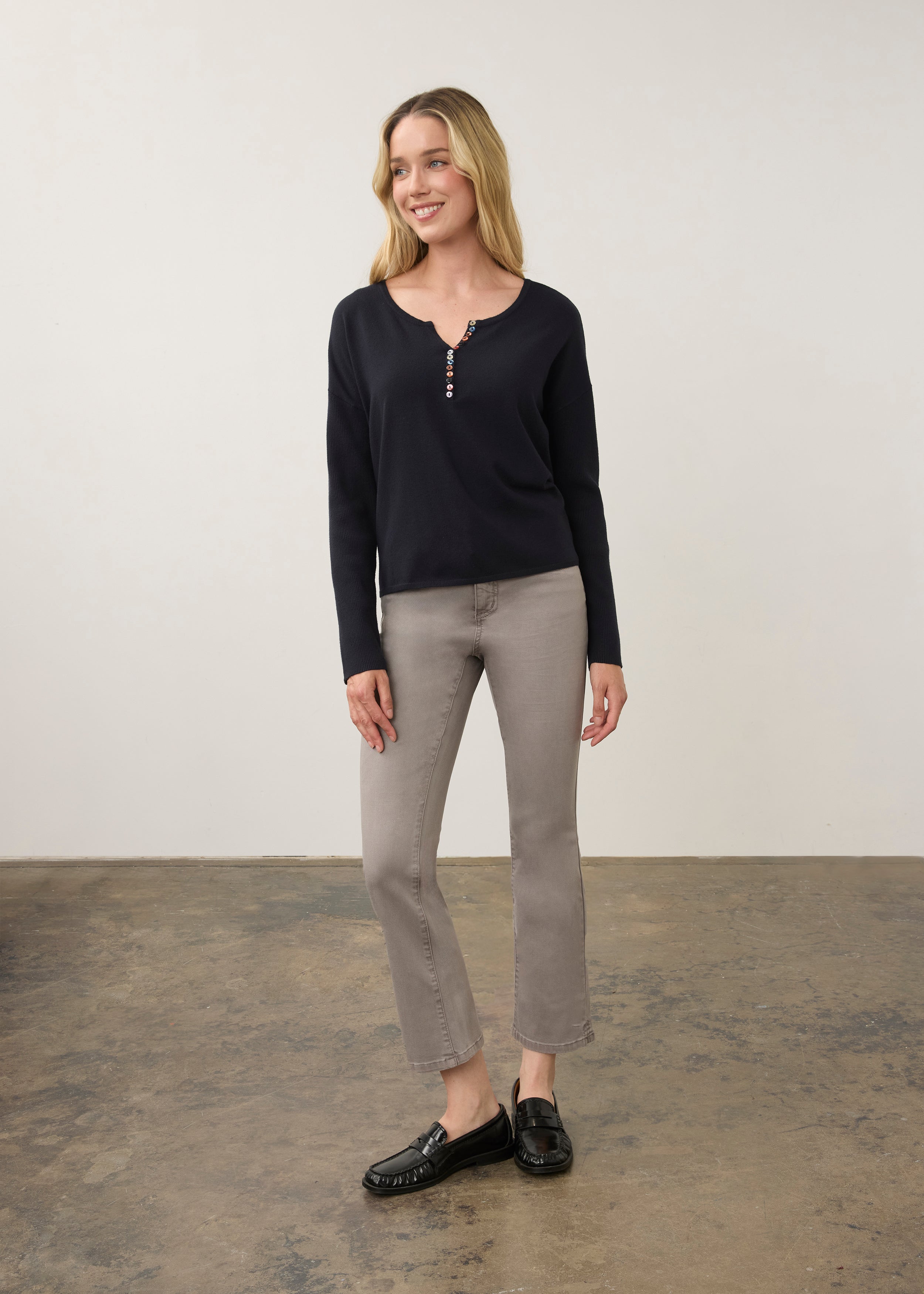 Full view of navy sweater paired with grey jeans by French Dressing Jeans (FDJ)