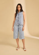 Full view of model in sleeveless denim top and shorts in powder wash by French Dressing Jeans (FDJ)