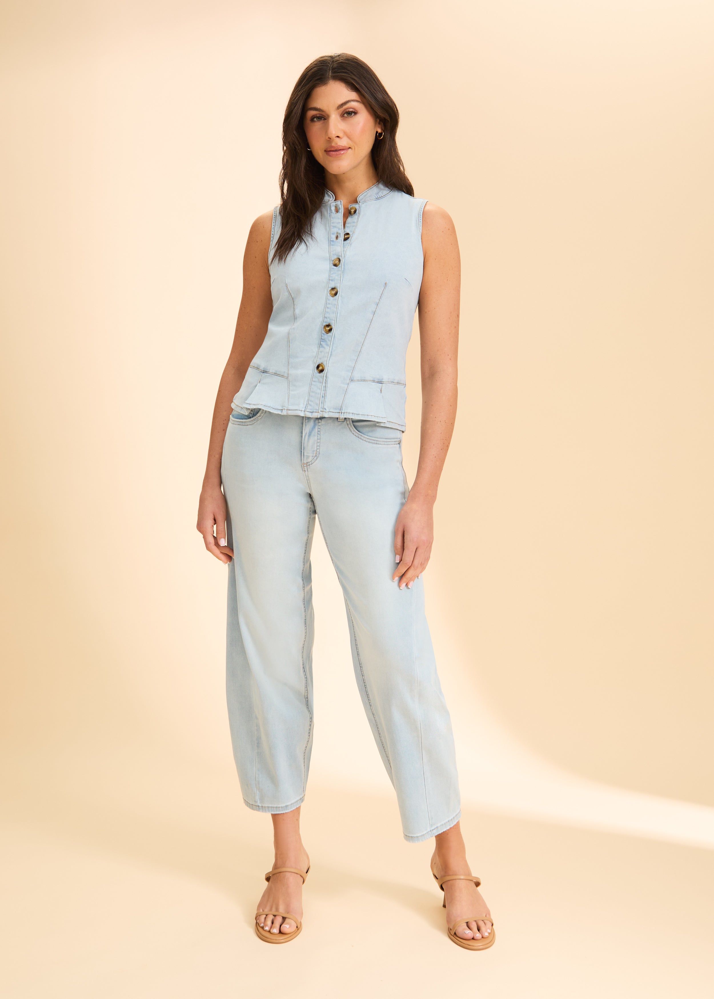 Front view of light wash sleeveless denim top with button closure by French Dressing Jeans (FDJ)