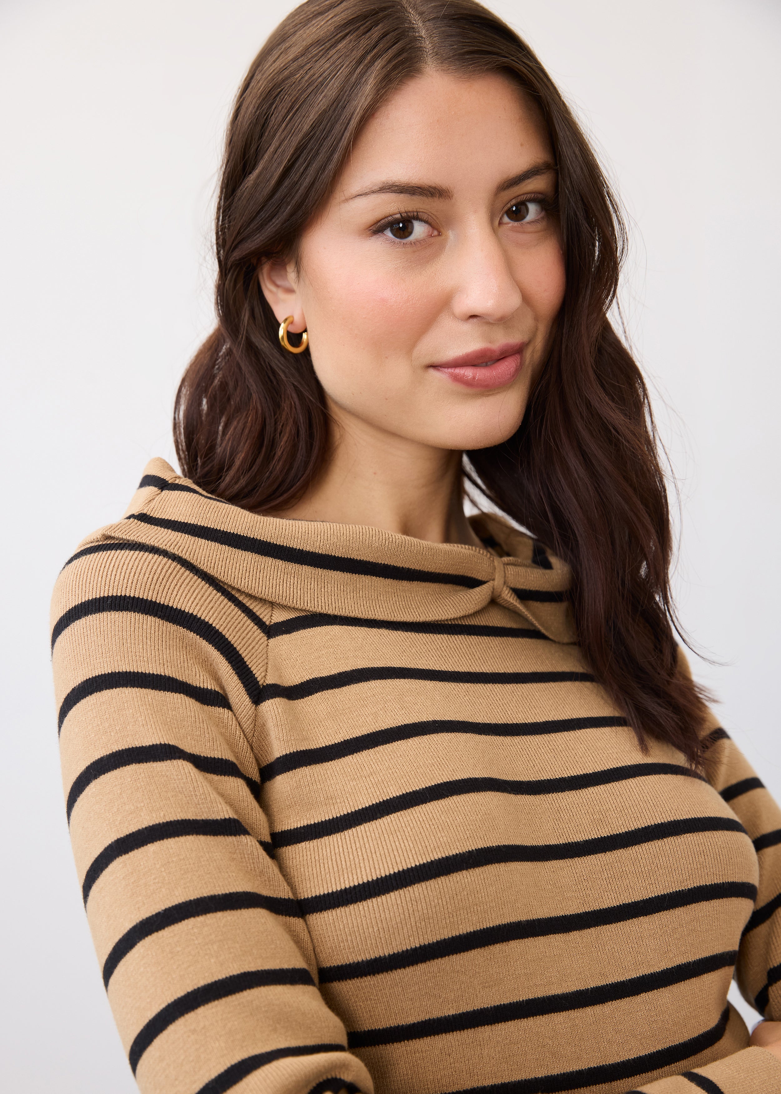 Close-up of striped tan and black sweater highlighting neckline by French Dressing Jeans (FDJ)