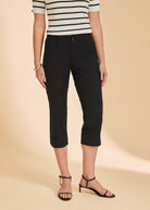 Detail shot of black crop pants emphasizing high-rise waist and sleek design by French Dressing Jeans (FDJ)