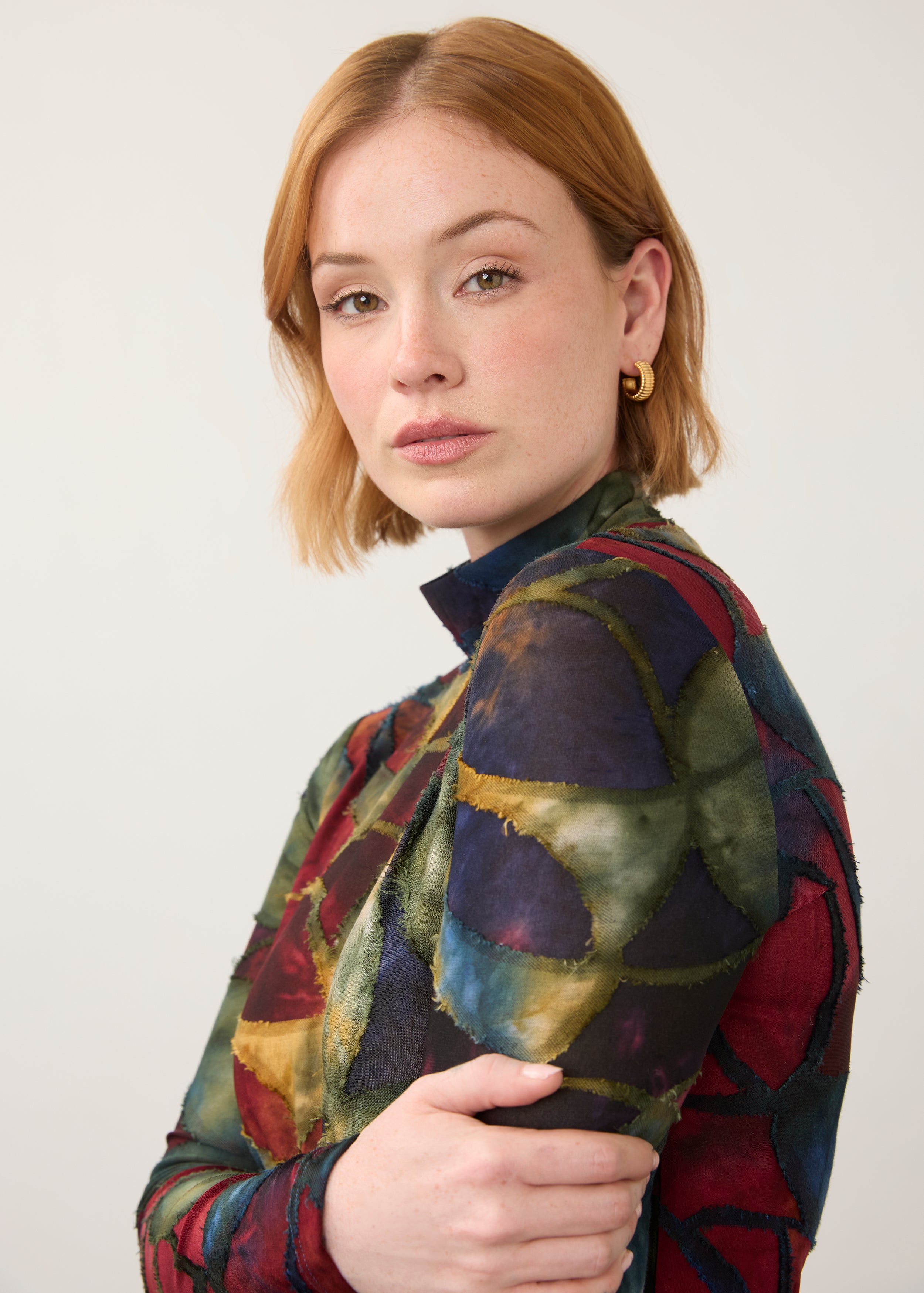 Close-up of abstract print top, showcasing detailed pattern and high neckline by French Dressing Jeans (FDJ)