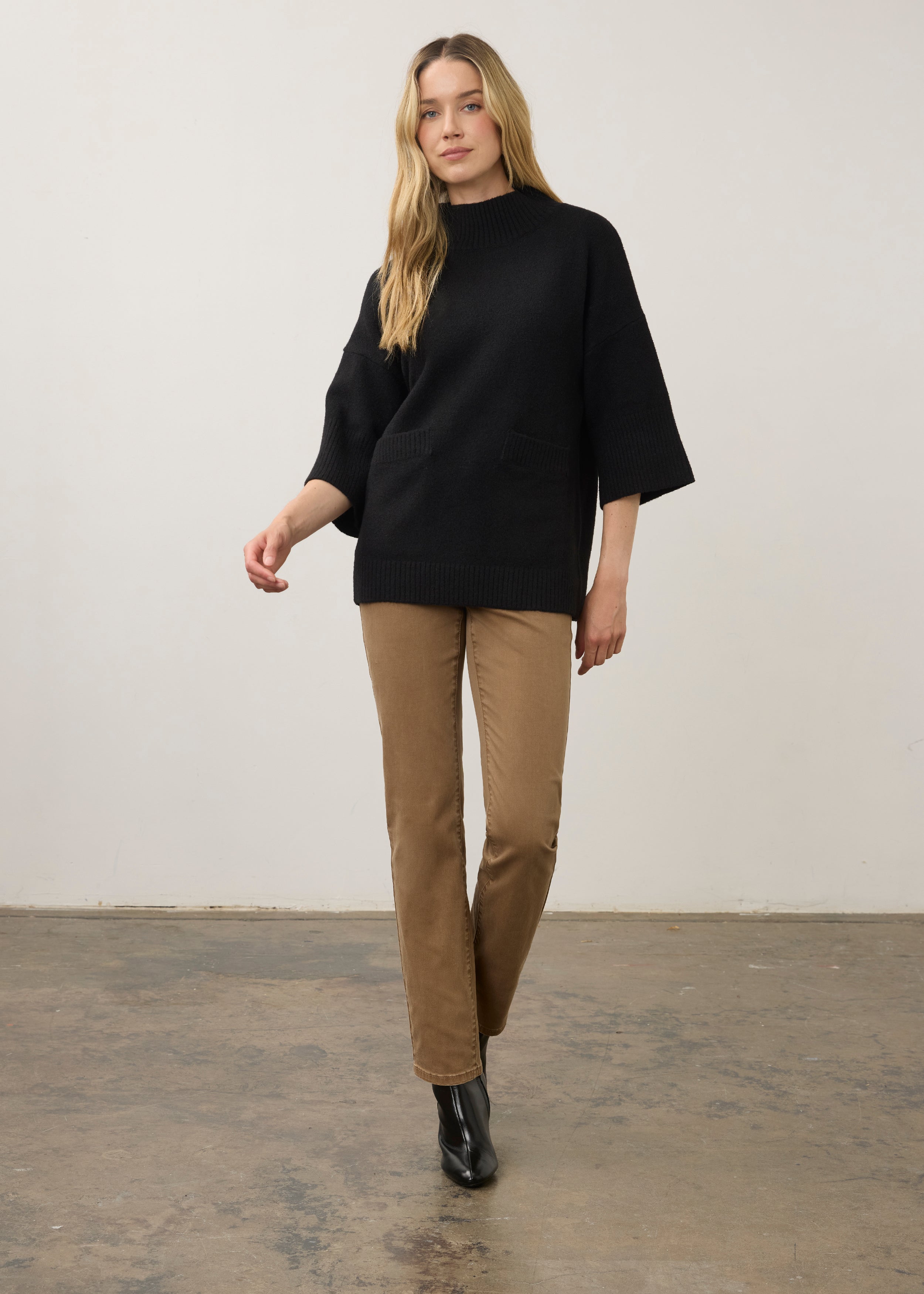 Full view of black tunic sweater with tan pants and boots by French Dressing Jeans (FDJ)
