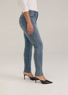 Side profile of light wash slim leg jeans showcasing fit and style by French Dressing Jeans (FDJ)