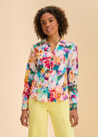 Front view of vibrant floral split neck shirt with button front by French Dressing Jeans (FDJ)