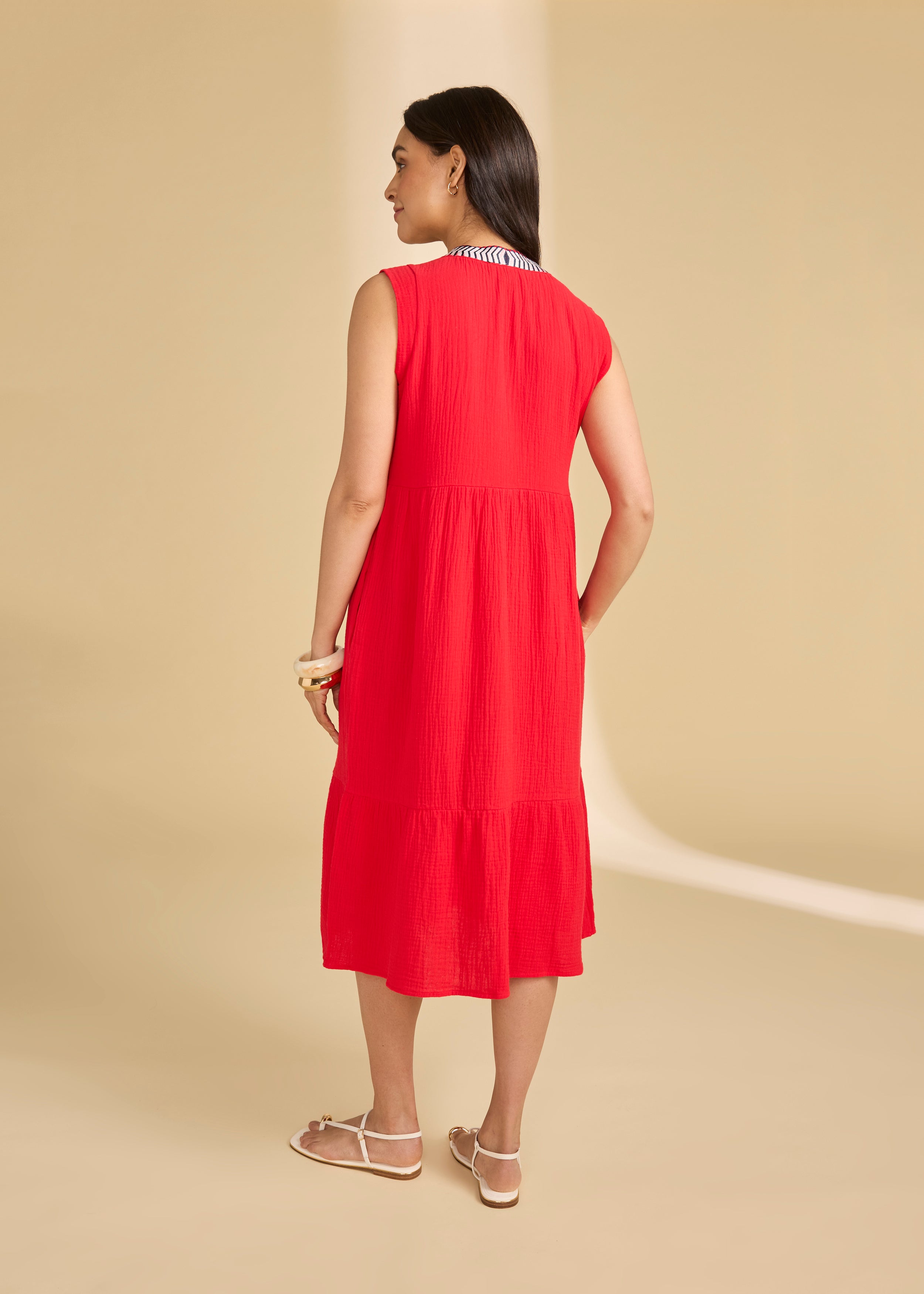 Back view of lava red tiered midi dress showing seamless flow and sleeveless design by French Dressing Jeans (FDJ)