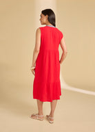 Back view of lava red tiered midi dress showing seamless flow and sleeveless design by French Dressing Jeans (FDJ)