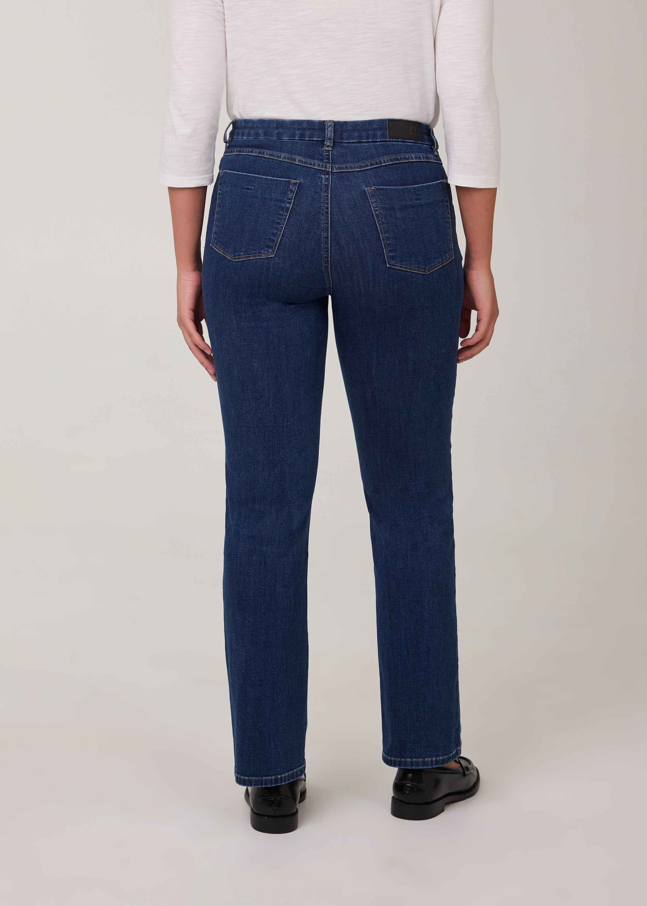 Back view of tapered straight leg jeans in Delight color with patch pockets by French Dressing Jeans (FDJ)
