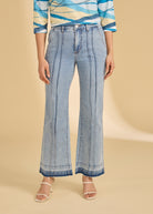 Front view of light metallic lime trousers with vertical seam detail by French Dressing Jeans (FDJ)