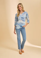 Full view of watercolor print top with light blue jeans by French Dressing Jeans (FDJ)