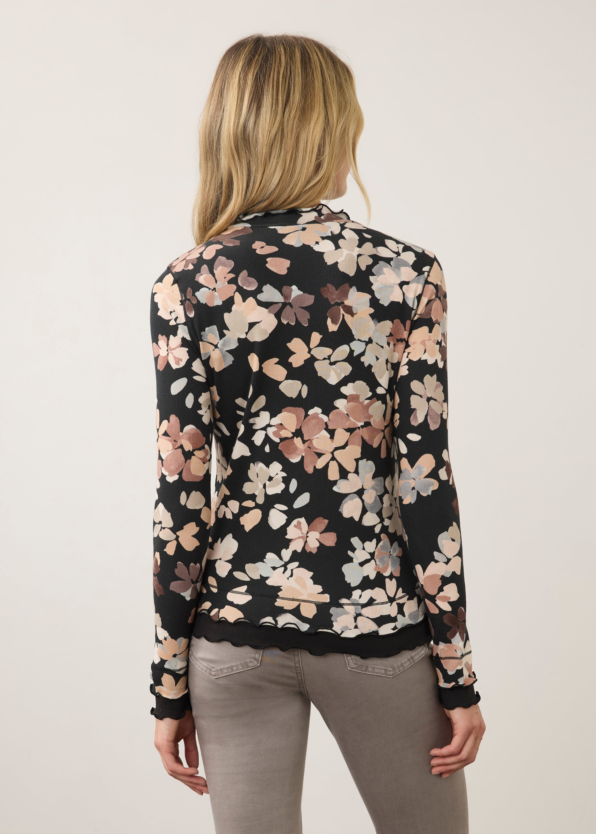 Back view of floral black top, highlighting seamless design and scalloped edges by French Dressing Jeans (FDJ)
