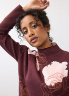 Close-up of burgundy floral sweater showing rose design and collar detail by French Dressing Jeans (FDJ)