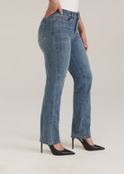 Side profile of Olivia straight leg denim in light wash highlighting slim fit and mid-rise waist by French Dressing Jeans (FDJ)