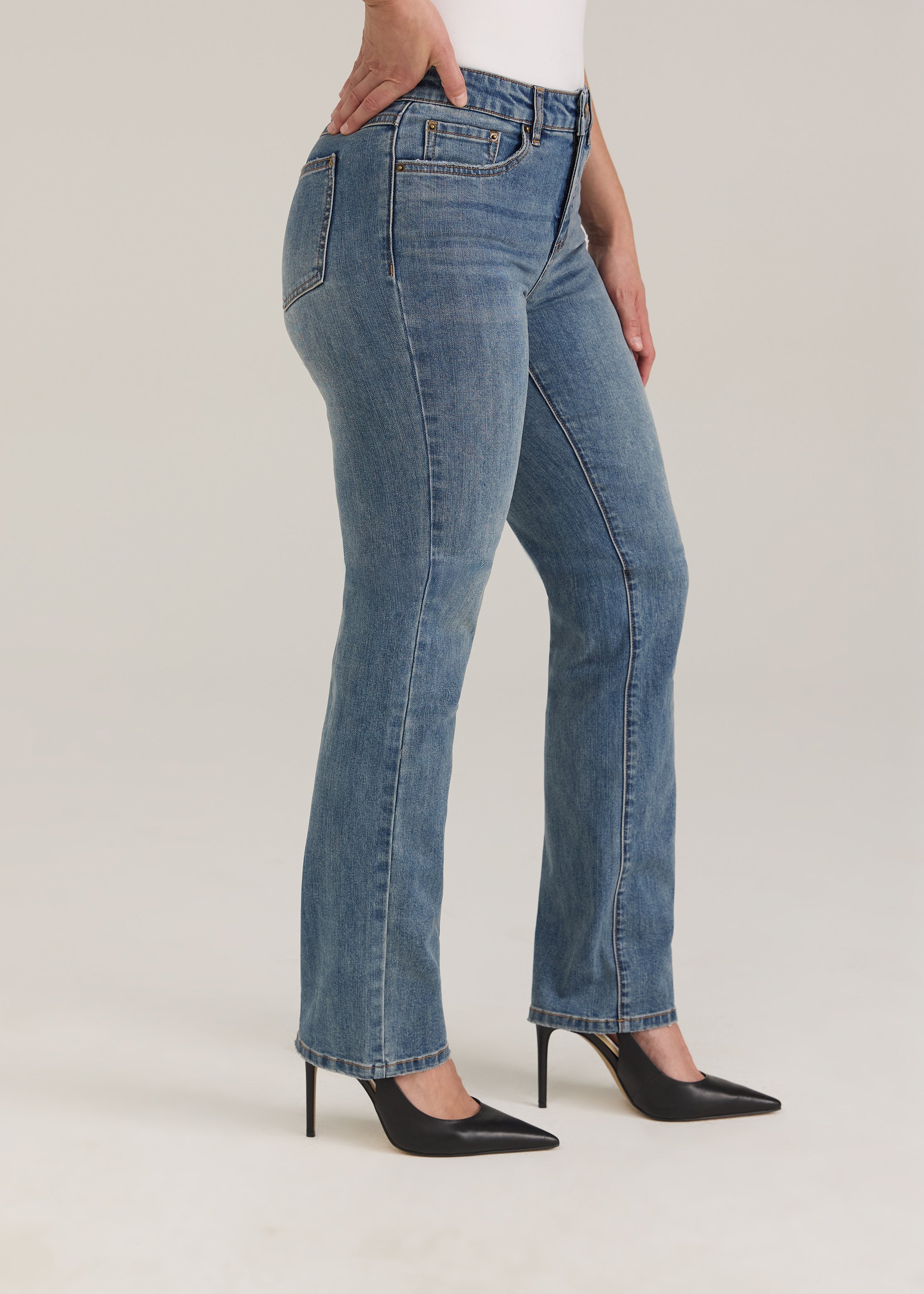 Side profile of Olivia straight leg denim in light wash highlighting slim fit and mid-rise waist by French Dressing Jeans (FDJ)