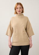 Front view of beige tunic sweater highlighting front pockets and sleeve detail by French Dressing Jeans (FDJ)