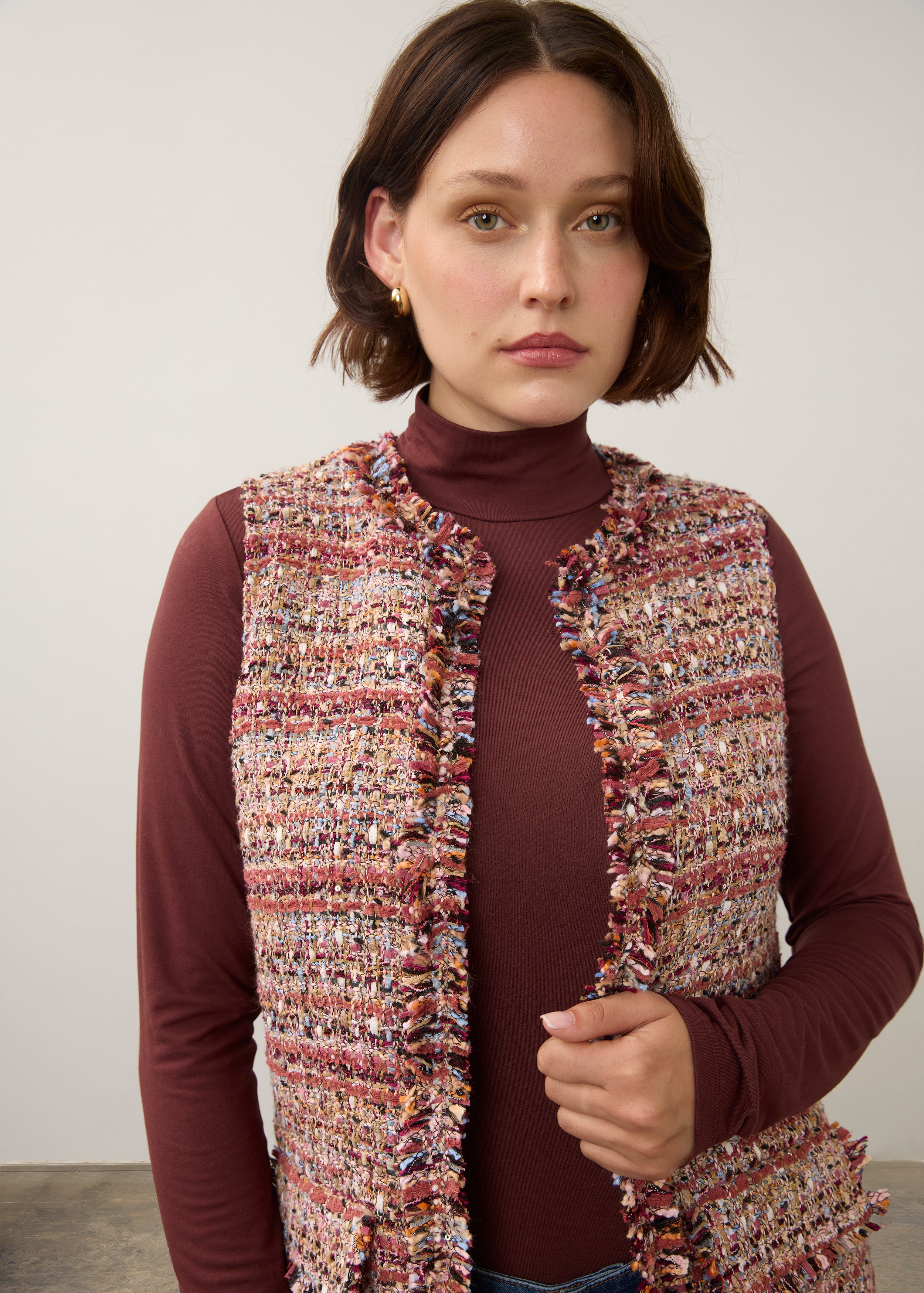 Close-up of multicolored textured vest showing buttonless open front by French Dressing Jeans (FDJ)
